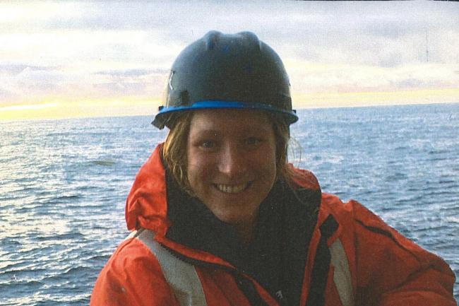 Tanika Ladd wearing a helmet on a boat